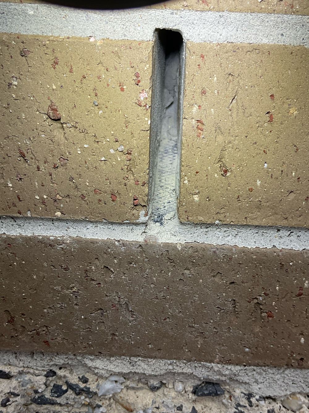 Obstructed weep holes, recorded on a fixing stage inspection in Fraser Rise