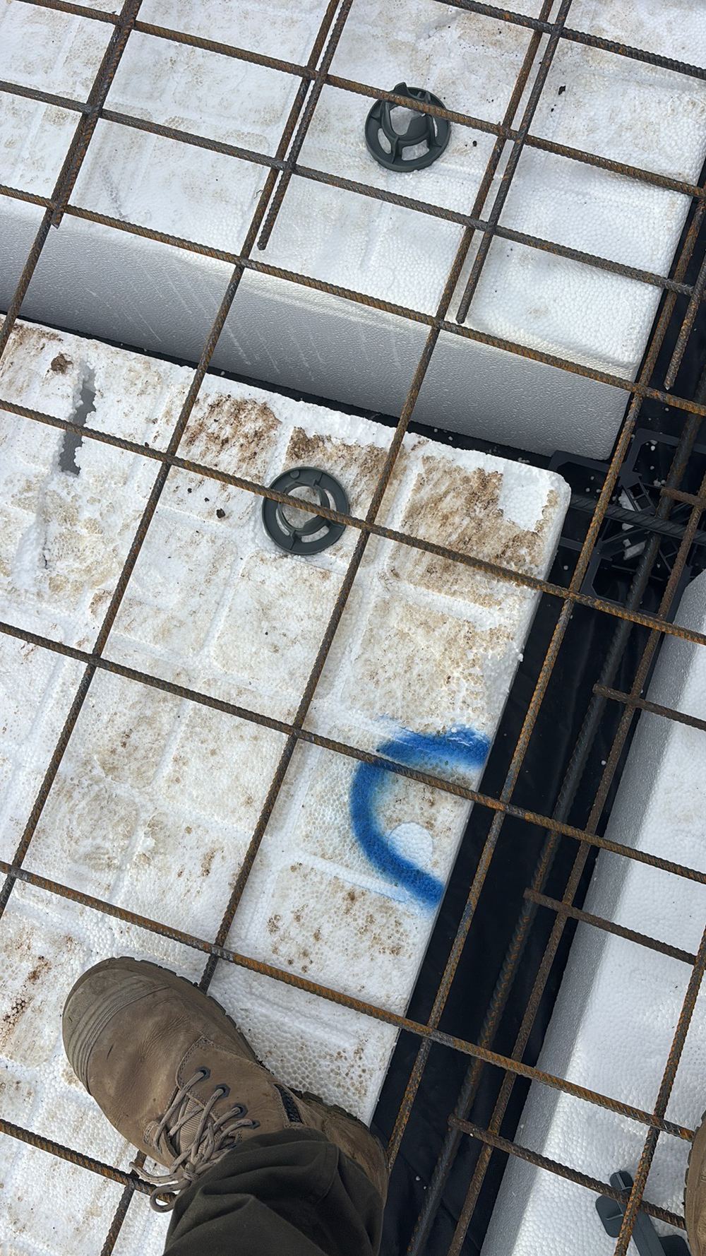 Footing reinforcement needing bar chairs, recorded on a slab pre-pour inspection in Fraser Rise