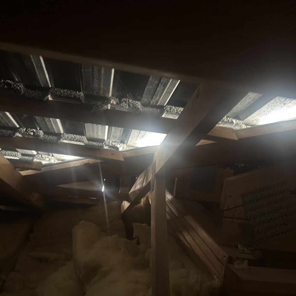 Roof valley board side openings letting water in, recorded on a defect investigation in Winter Valley