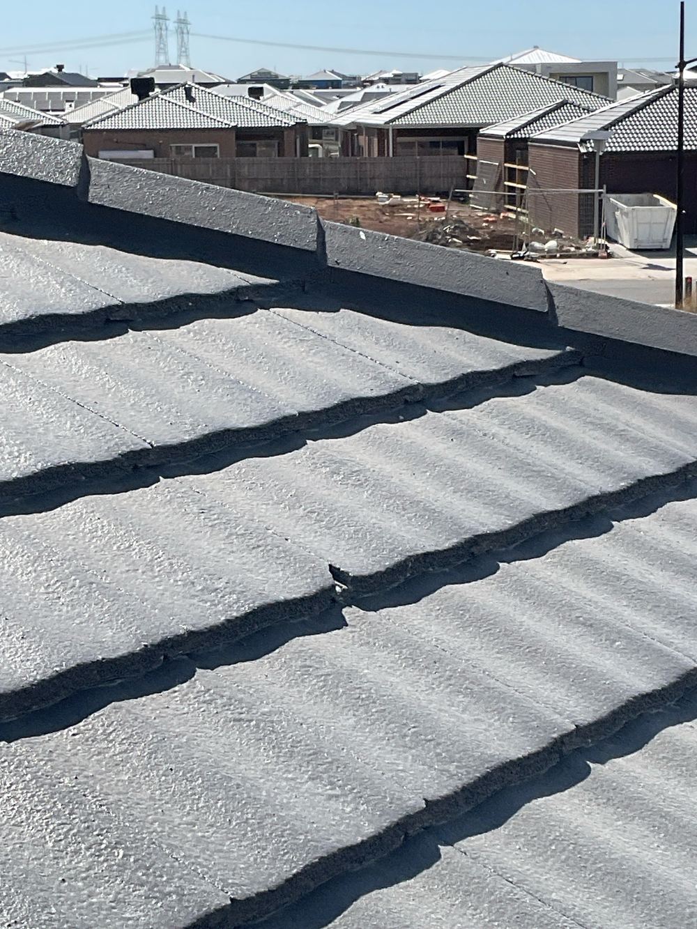Cracked roof tile, recorded on a pre-handover inspection in Fraser Rise